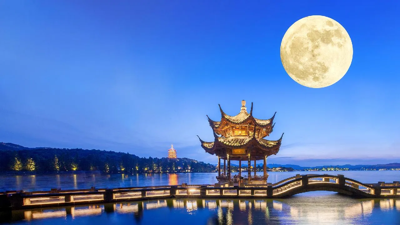 Full moon over a serene lake